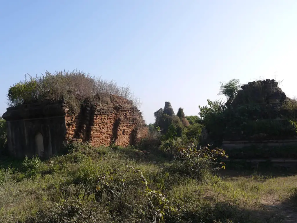 Some remaining structures with old stupas in the background. 