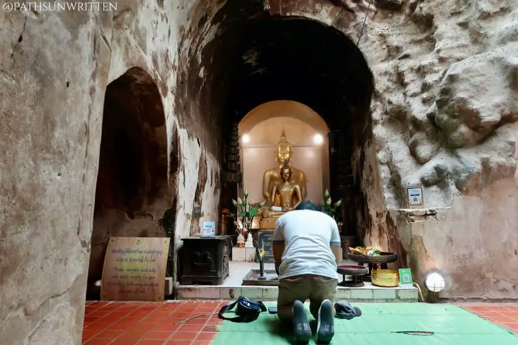 Praying at the tunnel's wiharn.