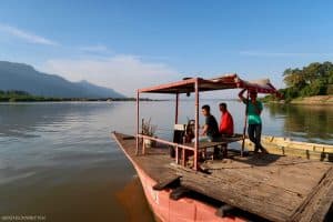 The Mekong ferries are two or more boats connected by wooden platform and can carry anything from a motorbike to a minibus.