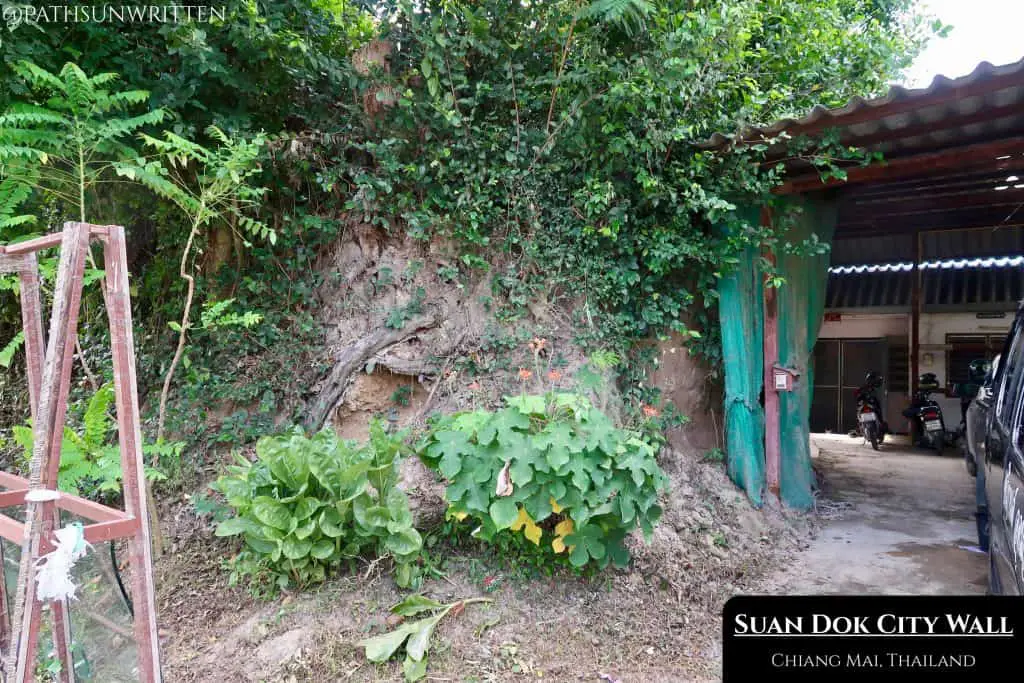 Sections of Wiang Suan Dok's southern wall have been torn down by private residences.