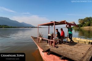 A Mekong River ferry shuttles cars and motorbikes between Champasak's east and west banks.