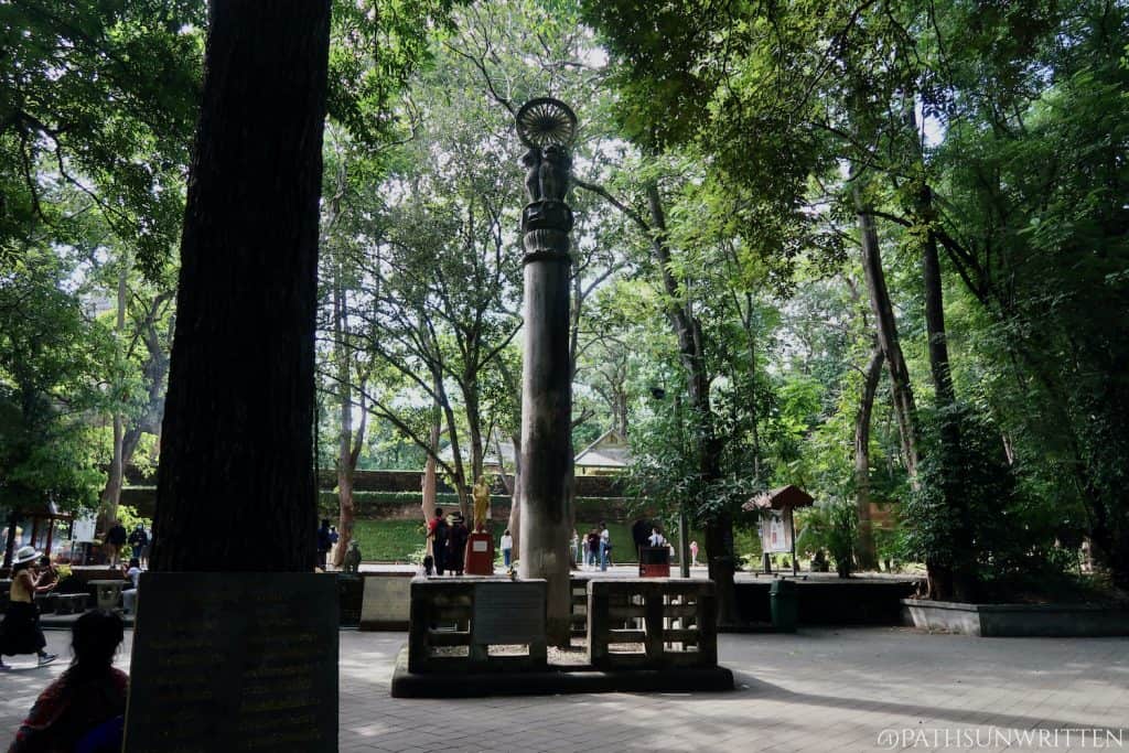 The modern Ashoka Pillar in the Wat Umong courtyard.