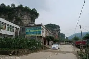 The first view of the cliffs as you reach the Matangba (麻塘坝) valley floor