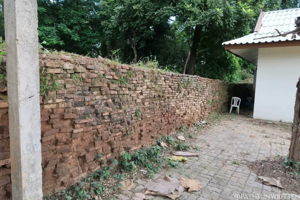 Part of the ancient wall alongside the Wat Pratu Pong temple.