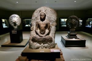 Carved Dvaravati stone images on display at the U Thong National Museum.