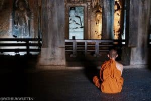 Buddhist monk meditating in the Ajanta Caves
