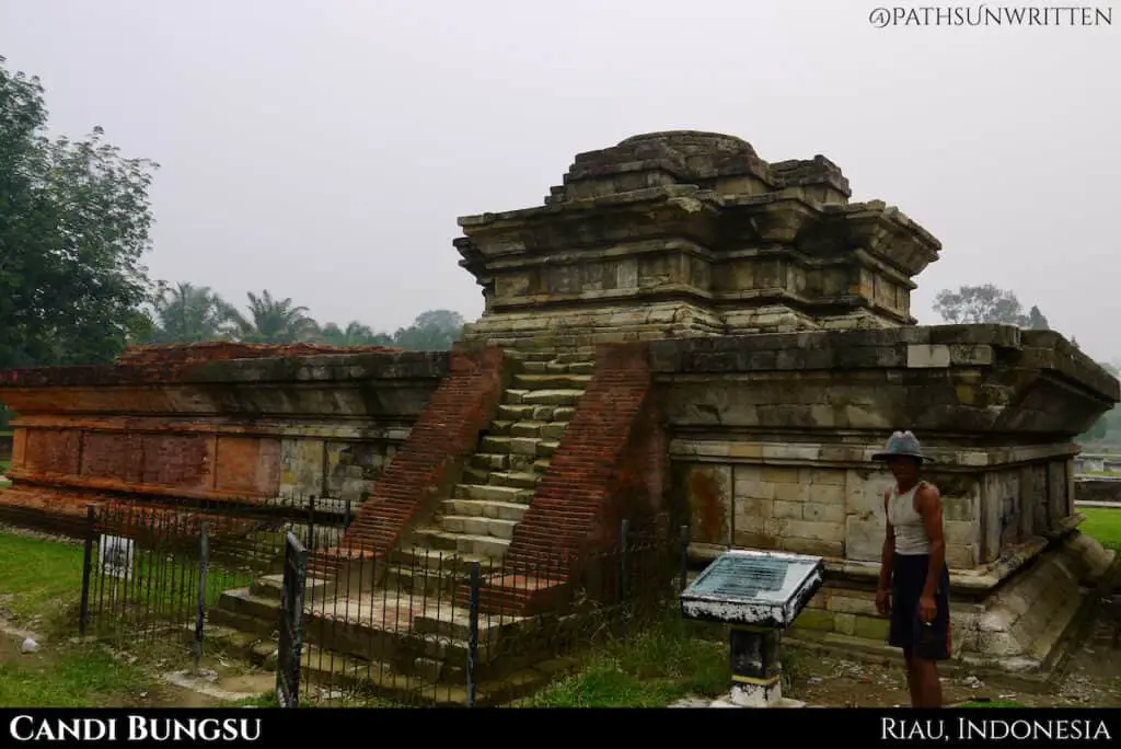 Candi Bugnsu's earlier north side is made of sandstone with a later brick extension on the south side